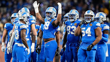 Detroit Lions defensive end Za'Darius Smith (99) cheers on during a huddle before a play against the Chicago Bears during the first half at Ford Field.