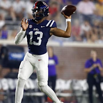 Aug 31, 2024; Oxford, Mississippi, USA; Mississippi Rebels quarterback Austin Simmons (13) passes the ball during the second half  against the Furman Paladins at Vaught-Hemingway Stadium. Mandatory Credit: Petre Thomas-Imagn Images