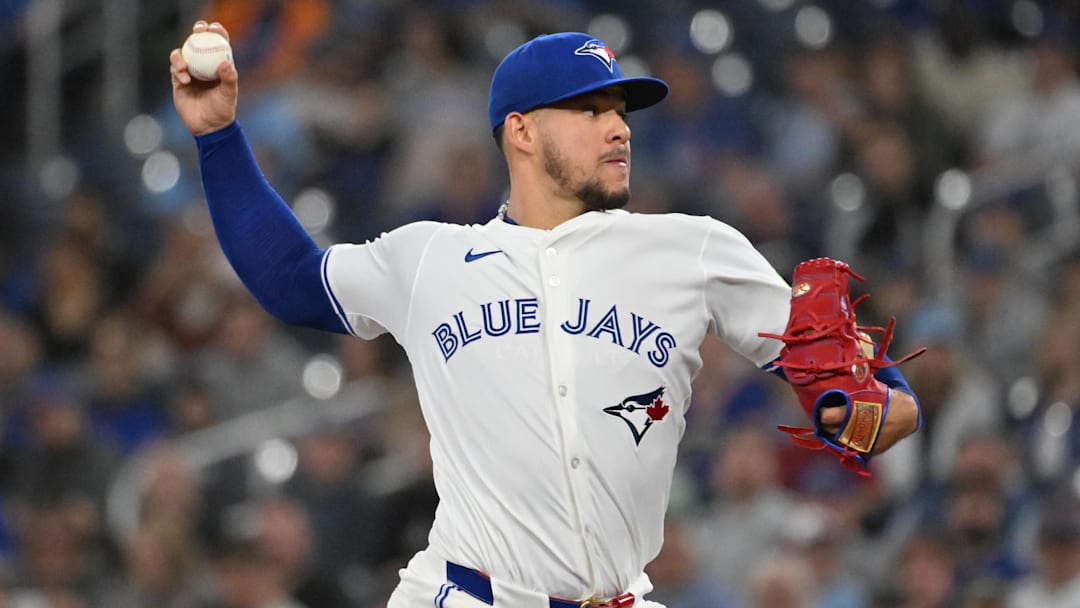 Apr 19, 2025; Toronto, Ontario, CAN;  Toronto Blue Jays starting pitcher Jose Berrios (17) delivers a pitch against the Seattle Mariners in the first inning at Rogers Centre. 