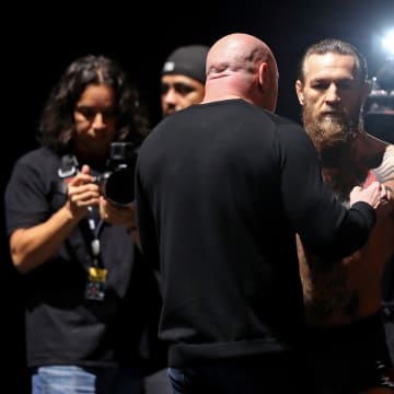 Jan 17, 2020; Las Vegas, Nevada, USA; UFC president Dana White (left) talks with Conor McGregor during weigh ins for UFC 246 at T-Mobile Arena.