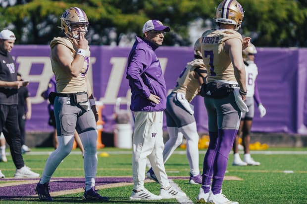 Jedd Fisch hangs out with his quarterbacks during spring ball. 