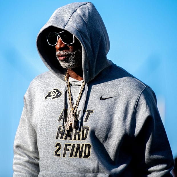 CU football head coach Deion Sanders, or Coach Prime, watches his team warm up before the game against CSU in the Rocky Mount