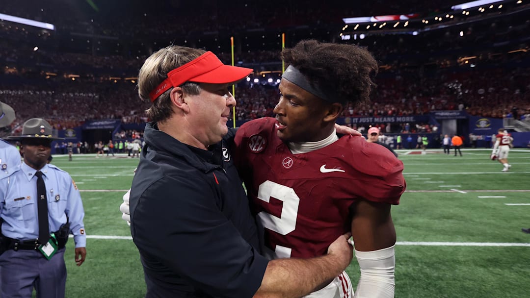 Dec 2, 2023; Atlanta, GA, USA;  Georgia Bulldogs head coach Kirby Smart embraces Alabama Crimson Tide defensive back Caleb Downs (2) after the SEC championship game at Mercedes-Benz Stadium. Mandatory Credit: Brett Davis-Imagn Images