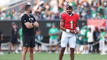 Aug 1, 2024; Philadelphia, PA, USA; Philadelphia Eagles quarterback Jalen Hurts (1) talks with head coach Nick Sirianni (L) during a practice at Lincoln Financial Field. Mandatory Credit: Bill Streicher-Imagn Images