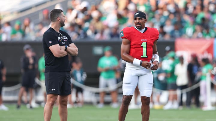 Aug 1, 2024; Philadelphia, PA, USA; Philadelphia Eagles quarterback Jalen Hurts (1) talks with head coach Nick Sirianni (L) during a practice at Lincoln Financial Field. Bill Streicher-USA TODAY Sports