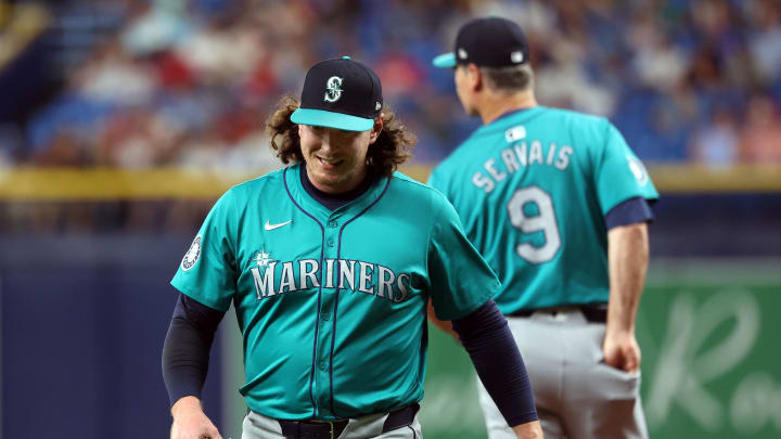 Seattle Mariners pitcher Mike Baumann (53) is taken out of the game by manager Scott Servais (9) during the sixth inning against the Tampa Bay Rays  at Tropicana Field on July 25.