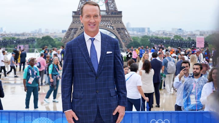 Jul 26, 2024; Paris, FRANCE; Peyton Manning poses for a photo in front of the Eiffel Tower before the Opening Ceremony for the Paris 2024 Olympic Summer Games.