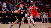 Oct 27, 2025; Houston, Texas, USA; Brooklyn Nets guard Nolan Traore (88) drives to the basket against Houston Rockets forward Jae'Sean Tate (8) during the fourth quarter at Toyota Center. Mandatory Credit: Erik Williams-Imagn Images
