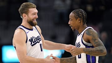 Dec 6, 2024; San Antonio, Texas, USA; Sacramento Kings center Domantas Sabonis (11) and forward DeMar DeRozan (10) embrace before a game the San Antonio Spurs at Frost Bank Center. Mandatory Credit: Scott Wachter-Imagn Images