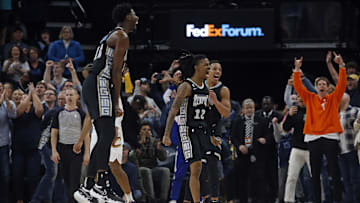 Jan 18, 2023; Memphis, Tennessee, USA; Memphis Grizzlies guard Ja Morant (12), guard Desmond Bane (22) and forward Jaren Jackson Jr. (13) react after defeating the Cleveland Cavaliers at FedExForum. Mandatory Credit: Petre Thomas-Imagn Images