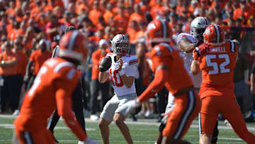 Oct 11, 2025; Champaign, Illinois, USA; Ohio State Buckeyes quarterback Julian Sayin (10) throws downfield during the first quarter against the Illinois Fighting Illini at Memorial Stadium. Mandatory Credit: Ron Johnson-Imagn Images