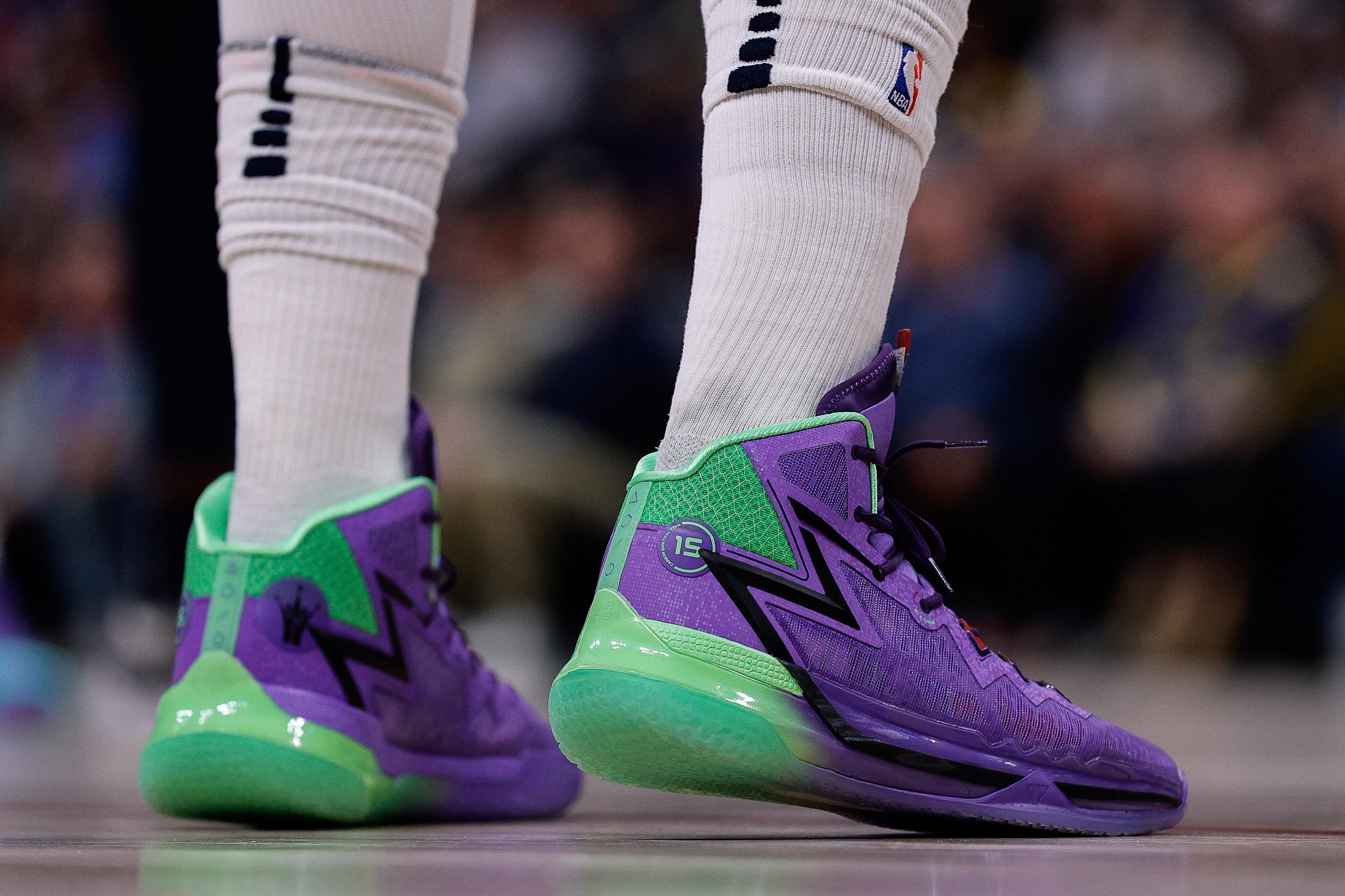 Denver Nuggets center Nikola Jokic's purple and green sneakers.