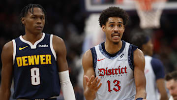 Dec 7, 2024; Washington, District of Columbia, USA; Washington Wizards guard Jordan Poole (13) yells at an official as Denver Nuggets forward Peyton Watson (8) looks on in the fourth quarter at Capital One Arena. Mandatory Credit: Geoff Burke-Imagn Images