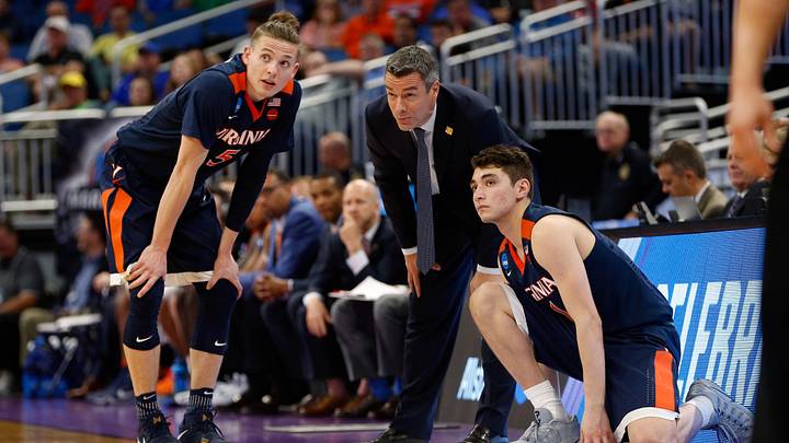 Mar 18, 2017; Orlando, FL, USA; Virginia Cavaliers head coach Tony Bennett talks with Virginia Cavaliers guard Kyle Guy (5) and guard Ty Jerome (11) during the second half in the second round of the 2017 NCAA Tournament at Amway Center. Mandatory Credit: Kim Klement-Imagn Images