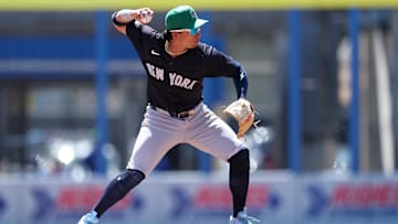 Mar 17, 2025; Dunedin, Florida, USA; New York Yankees third baseman Oswaldo Cabrera (95) turns a double play against the Toronto Blue Jays in the first inning during spring training at TD Ballpark. Mandatory Credit: Nathan Ray Seebeck-Imagn Images