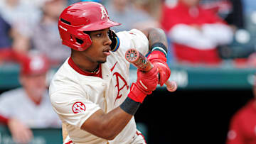 Justin Thomas Jr. shows bunt at the plate for the Arkansas Razorbacks. 