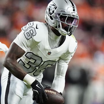 Nov 6, 2025; Denver, Colorado, USA; Las Vegas Raiders cornerback Kyu Blu Kelly (36) intercepts a pass against the Denver Broncos during the first half at Empower Field at Mile High. Mandatory Credit: Ron Chenoy-Imagn Images