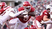 Arkansas Razorbacks running back Braylen Russell (0) rushes for a touchdown during the fourth quarter against the Mississippi State Bulldogs at Razorback Stadium.