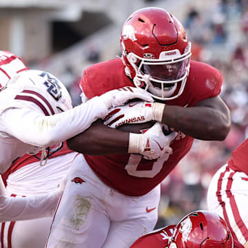 Arkansas Razorbacks running back Braylen Russell (0) rushes for a touchdown during the fourth quarter against the Mississippi State Bulldogs at Razorback Stadium.