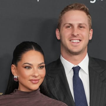 Jared Goff and his wife Christen Harper on the red carpet before Super Bowl LIX NFL Honors at Saenger Theatre