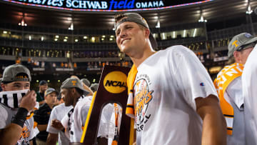 Tennessee's Drew Beam holds the trophy after game three of the NCAA College World Series finals between Tennessee and Texas A&M at Charles Schwab Field in Omaha, Neb., on Monday, June 24, 2024.