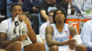 Jan 7, 2023; Chapel Hill, North Carolina, USA;  North Carolina Tar Heels forward Armando Bacot (5) and Heels guard Caleb Love (2) look on from the players bench against the Notre Dame Fighting Irish during the second half at Dean E. Smith Center. 