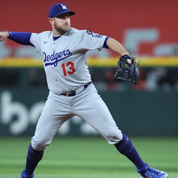 Apr 18, 2025; Arlington, Texas, USA; Los Angeles Dodgers third baseman Max Muncy (13) throws to first during the third inning against the Texas Rangers at Globe Life Field. Mandatory Credit: Tim Heitman-Imagn Images