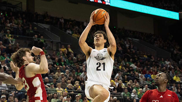 Oregon’s Brandon Angel, center, goes up for a shot against Nebraska during the second half.