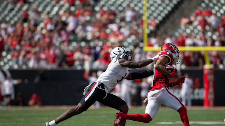 Cincinnati Bearcats safety Ja'von Hicks (3) takes down Miami (Oh) Redhawks wide receiver Mac Hippenhammer (0) during the third quarter of the NCAA football game between the Cincinnati Bearcats and the Miami RedHawks at Paycor Stadium in Cincinnati on Saturday, Sept. 17, 2022. The Cincinnati Bearcats defeated the Miami (Oh) Redhawks 38-17 in the 126th Battle for the Victory Bell.

Cincinnati Bearcats Football Vs Miami Redhawks Sept 17 2022