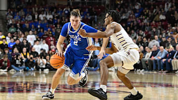 Jan 18, 2025; Chestnut Hill, Massachusetts, USA; Duke Blue Devils guard Cooper Flagg (2) dribbles the ball against Boston College Eagles guard Donald Hand Jr. (13) during the second half at Conte Forum. Mandatory Credit: Eric Canha-Imagn Images
