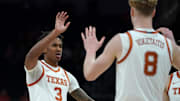 Texas Longhorns guard Dailyn Swain is congratulated by center Matas Vokietaitis during the first half against the Southern University Jaguars at Moody Center.