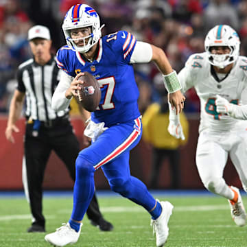 Sep 18, 2025; Orchard Park, New York, USA; Buffalo Bills quarterback Josh Allen (17) runs against the Miami Dolphins in the second half