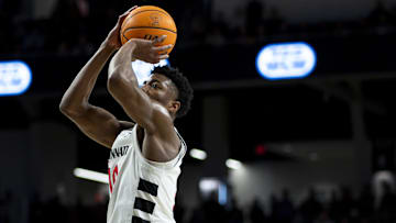 Former Cincinnati Bearcats guard Josh Reed shoots against the Baylor Bears. Reed is transferring to Penn State after two seasons in Cincinnati.