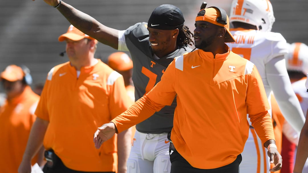 Tennessee quarterback Joe Milton III cheering on teammates by wide receiver coach Kelsey Pope during