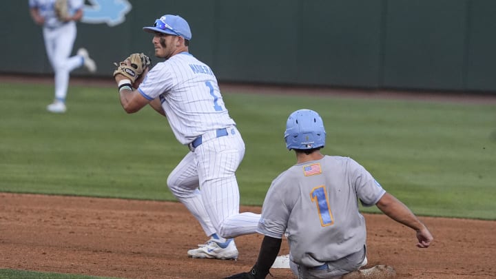 May 31, 2024; Chapel Hill, NC, USA; LIU shortstop Benjamin Fierenzi (1) slides late to second base defended by North Carolina infielder Alex Madera (1) during the NCAA regional in Chapel Hill, NC. Mandatory Credit: Jim Dedmon-USA TODAY Sports