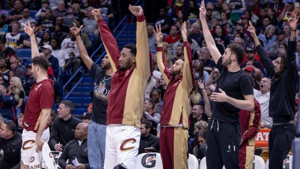 Cleveland Cavaliers bench reacts to a three-point basket.