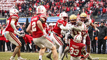 Dec 28, 2024; Bronx, NY, USA; Boston College Eagles wide receiver Lewis Bond (11) is tackled by Nebraska Cornhuskers linebacker Javin Wright (33) during the second half at Yankee Stadium. Mandatory Credit: Vincent Carchietta-Imagn Images