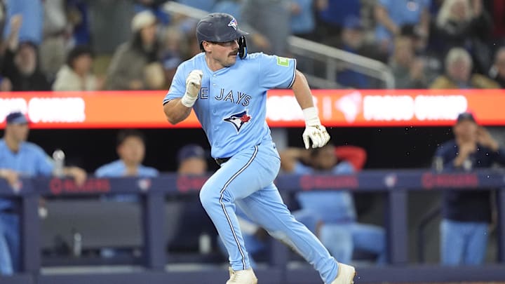 Apr 8, 2026; Toronto, Ontario, CAN; Toronto Blue Jays left fielder Davis Schneider (36) steals home after a throwing error to second base by Los Angeles Dodgers catcher Will Smith (not pictured) during the eighth inning at Rogers Centre. Mandatory Credit: John E. Sokolowski-Imagn Images