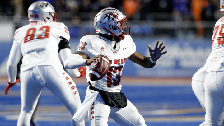 Nov 11, 2023; Boise, Idaho, USA;  New Mexico Lobos quarterback Devon Dampier (13) looks to throw during the second half against the Boise State Broncos at Albertsons Stadium. Boise State defeats New Mexico 42-14. Mandatory Credit: Brian Losness-USA TODAY Sports

