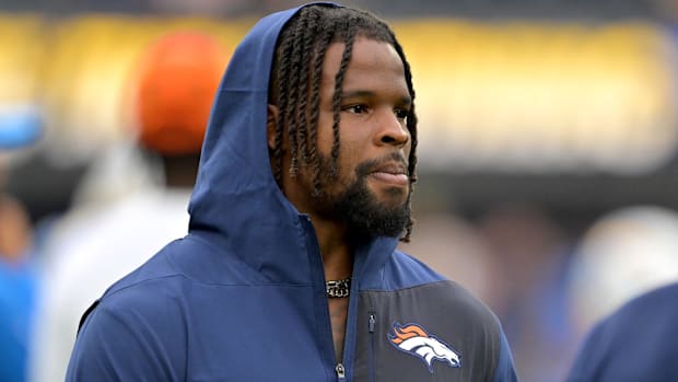 Denver Broncos linebacker Dre Greenlaw (57) on the sidelines prior to the game against the Los Angeles Chargers.