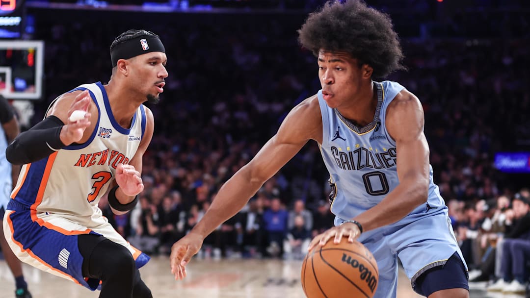 Nov 11, 2025; New York, New York, USA;  Memphis Grizzlies forward Jaylen Wells (0) looks to drive past New York Knicks guard Josh Hart (3) in the third quarter at Madison Square Garden. Mandatory Credit: Wendell Cruz-Imagn Images