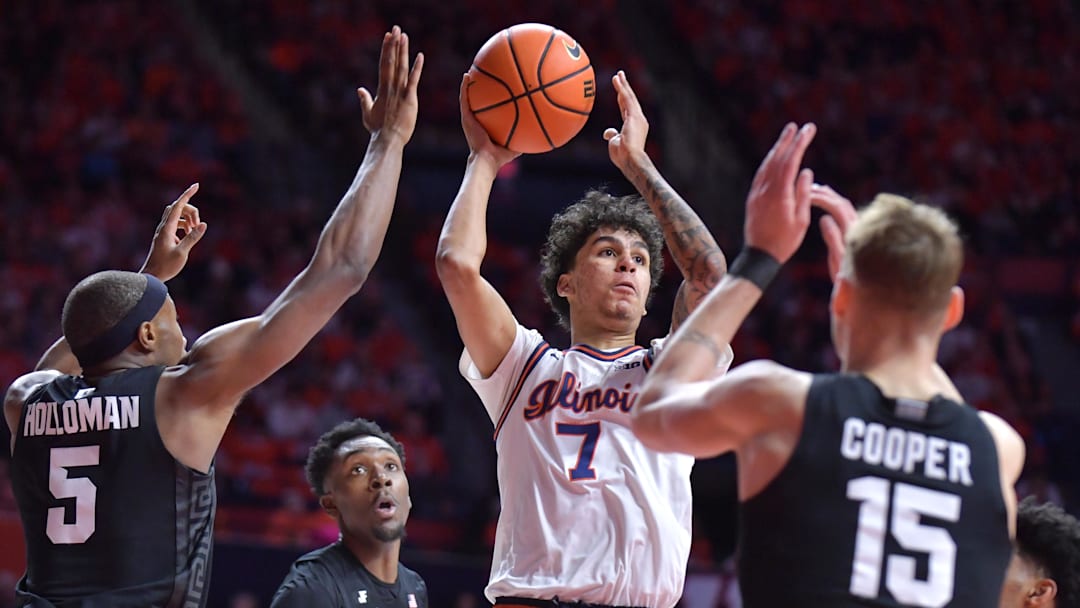 Feb 15, 2025; Champaign, Illinois, USA;  Illinois Fighting Illini forward Will Riley (7) looks to pass as he is surrounded by Michigan State Spartans during the first half at State Farm Center. Mandatory Credit: Ron Johnson-Imagn Images