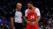 Apr 21, 2025; Denver, Colorado, USA; Los Angeles Clippers guard Norman Powell (24) talks with referee Marc Davis (8) in the third quarter against the Denver Nuggets during game two of first round for the 2025 NBA Playoffs at Ball Arena. Mandatory Credit: Isaiah J. Downing-Imagn Images