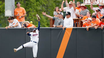 Arizona's Dakota Kennedy (4) can not catch the home run ball of Oklahoma State's Tallen Edwards in the first inning of Game 2 of the NCAA softball tournament Stillwater Super Regional between the Oklahoma State Cowgirls and the Arizona Wildcats in Stillwater, Okla., Saturday, May, 25, 2024.