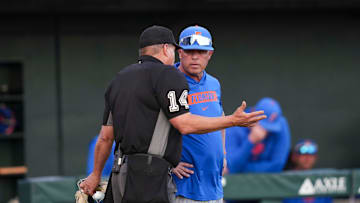 Florida head baseball coach Kevin O'Sullivan speaks to the umpire during a NCAA baseball game between the Tennessee Volunteers and Florida Gators at Lindsey Nelson Stadium in Knoxville, Tenn., on Friday, March 14, 2025.