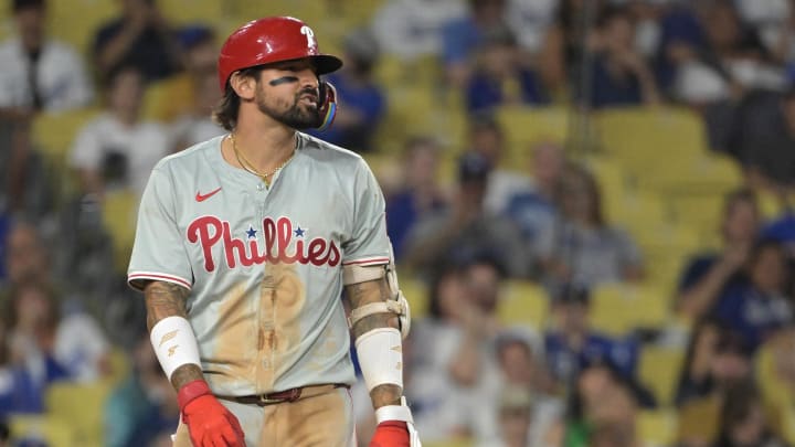 Aug 7, 2024; Los Angeles, California, USA;  Philadelphia Phillies right fielder Nick Castellanos (9) reacts after he was hit by a pitch in the eighth inning by Los Angeles Dodgers relief pitcher Michael Grove (29) at Dodger Stadium. 