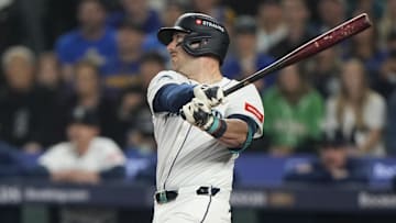 Oct 10, 2025; Seattle, Washington, USA; Seattle Mariners designated hitter Mitch Garver (18) hits a sacrifice fly against the Detroit Tigers during the second inning during game five of the ALDS round for the 2025 MLB playoffs at T-Mobile Park. Mandatory Credit: Stephen Brashear-Imagn Images