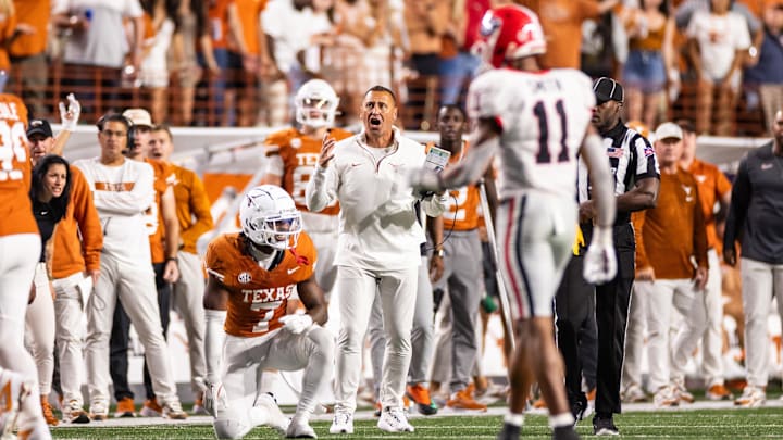 Texas Longhorns head coach Steve Sarkisian and corner back Jahdae Barron react after a pass interference call.