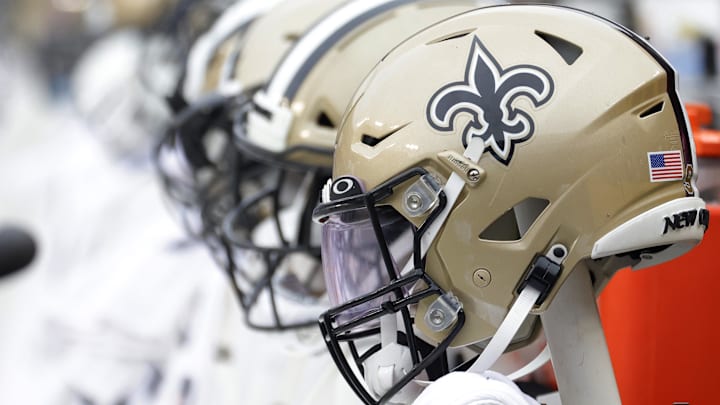 Oct 10, 2021; Landover, Maryland, USA; New Orleans Saints players' helmets on the bench against the Washington Football Team at FedExField. Mandatory Credit: Geoff Burke-Imagn Images Oct 10, 2021; Landover, Maryland, USA; New Orleans Saints players' helmets on the bench against the Washington Football Team at FedExField. Mandatory Credit: Geoff Burke-Imagn Images