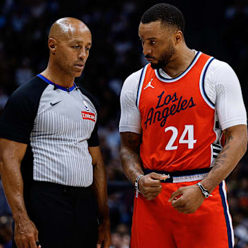 Apr 21, 2025; Denver, Colorado, USA; Los Angeles Clippers guard Norman Powell (24) talks with referee Marc Davis (8) in the third quarter against the Denver Nuggets during game two of first round for the 2025 NBA Playoffs at Ball Arena. Mandatory Credit: Isaiah J. Downing-Imagn Images